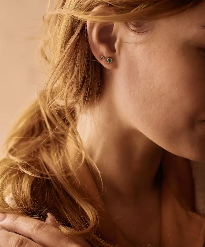 Gold Titanium Bezel Emerald